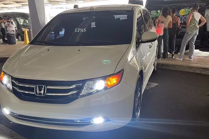 White Honda Odyssey minivan with EPAS sign at Amman Airport AMM transfer pickup area