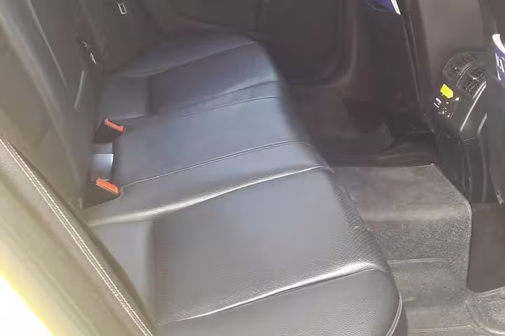 Spacious rear leather seats in private transfer vehicle from Athens to Port of Kyllini, clean and comfortable