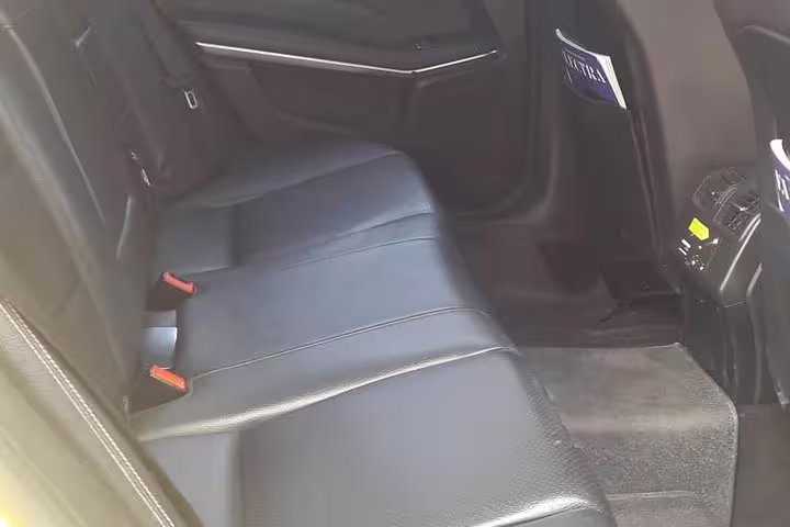 Spacious leather rear seats in private transfer vehicle from Kalabaka Meteora to Athens with AC