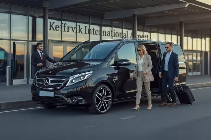 Luxury black Mercedes van at Keflavik International Airport with passengers and chauffeur