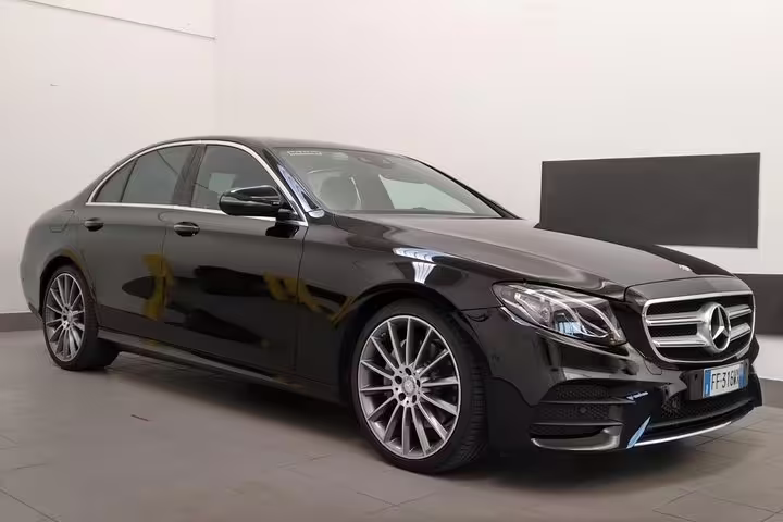 Luxurious black sedan for private transfer from Marco Polo airport to Venice cruise terminal.