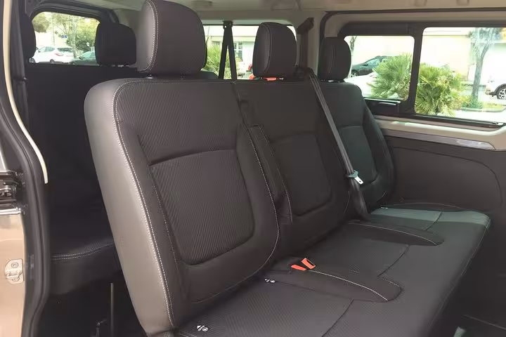 Comfortable leather rear seats in private transfer van from Marseille to Avignon with seatbelts and legroom