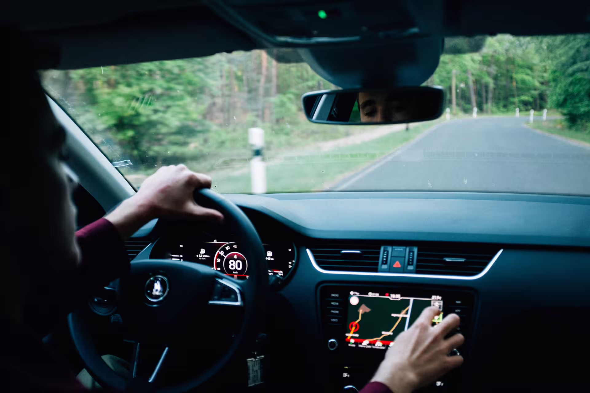 Professional driver using GPS navigation during a comfortable private transfer on the road from Naples to Benevento