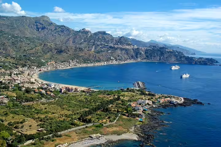 Business traveler stepping from a black executive car, showcasing VIP private transfer from Palermo Airport to Giardini Naxos