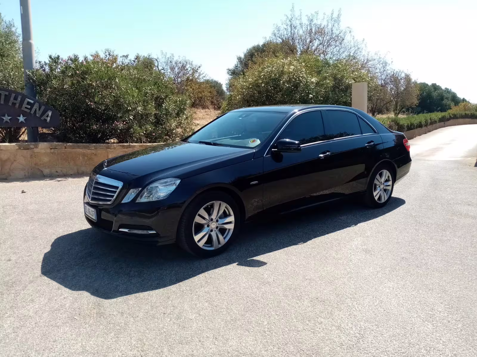 Executive black Mercedes sedan ready for private airport transfer between Palermo Airport and Hotel Excelsior Palace