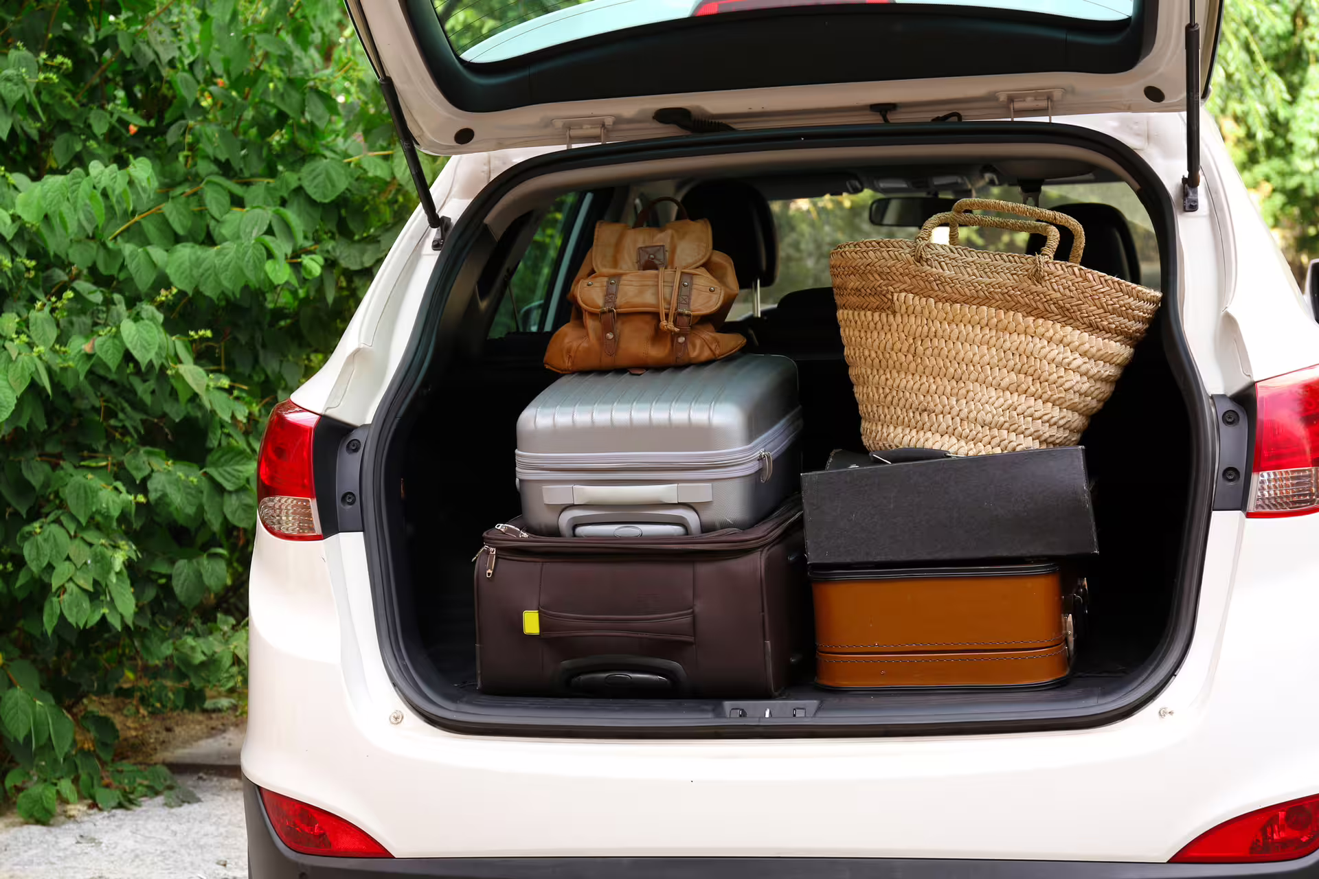 Car trunk packed with suitcases and bags ready for private transfer to Blue Lagoon