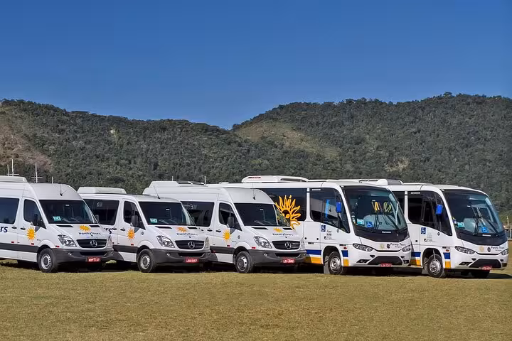 Fleet of modern private transport vans and minibuses ready for scenic travel from Búzios to Rio de Janeiro.