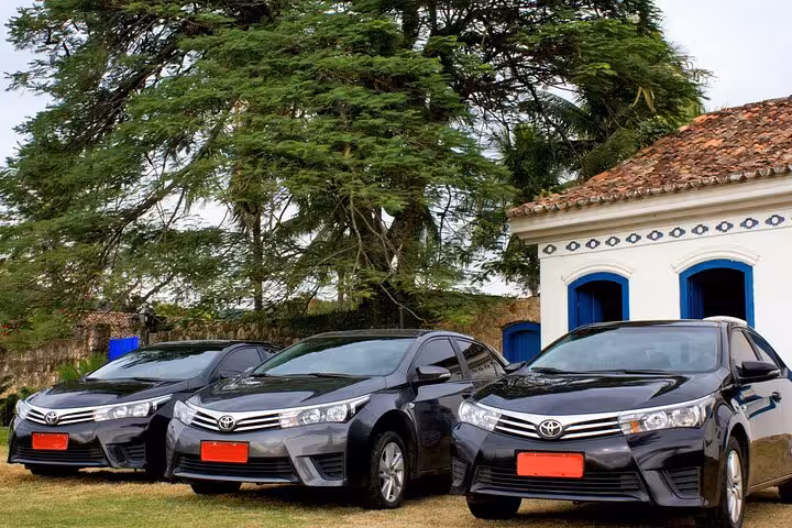 Private transport vehicles ready for scenic journey from Rio de Janeiro to Paraty, offering comfort and convenience.
