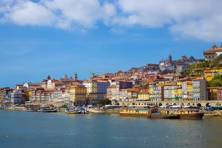 Scenic view of colorful historic buildings along the Douro River, perfect for a private tuk-tuk tour in the historic center.