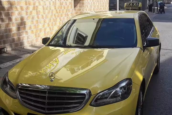 Taxi-style private vehicle for full-day tour to Ancient Sparta, Kaiadas cave and Mystras with lunch included