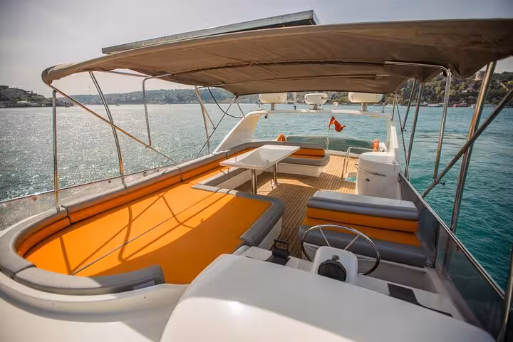Private yacht deck setup with shaded lounge seating, perfect for birthday or anniversary celebration cruise