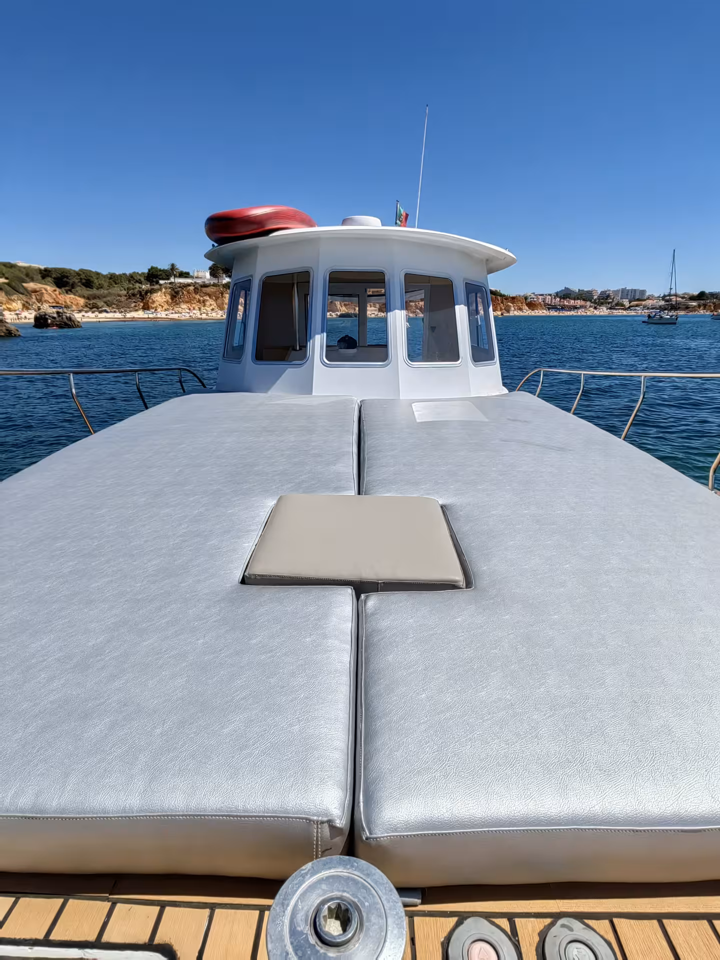 Spacious deck with comfortable seating on a private yacht, ideal for soaking up sun during a half-day charter.