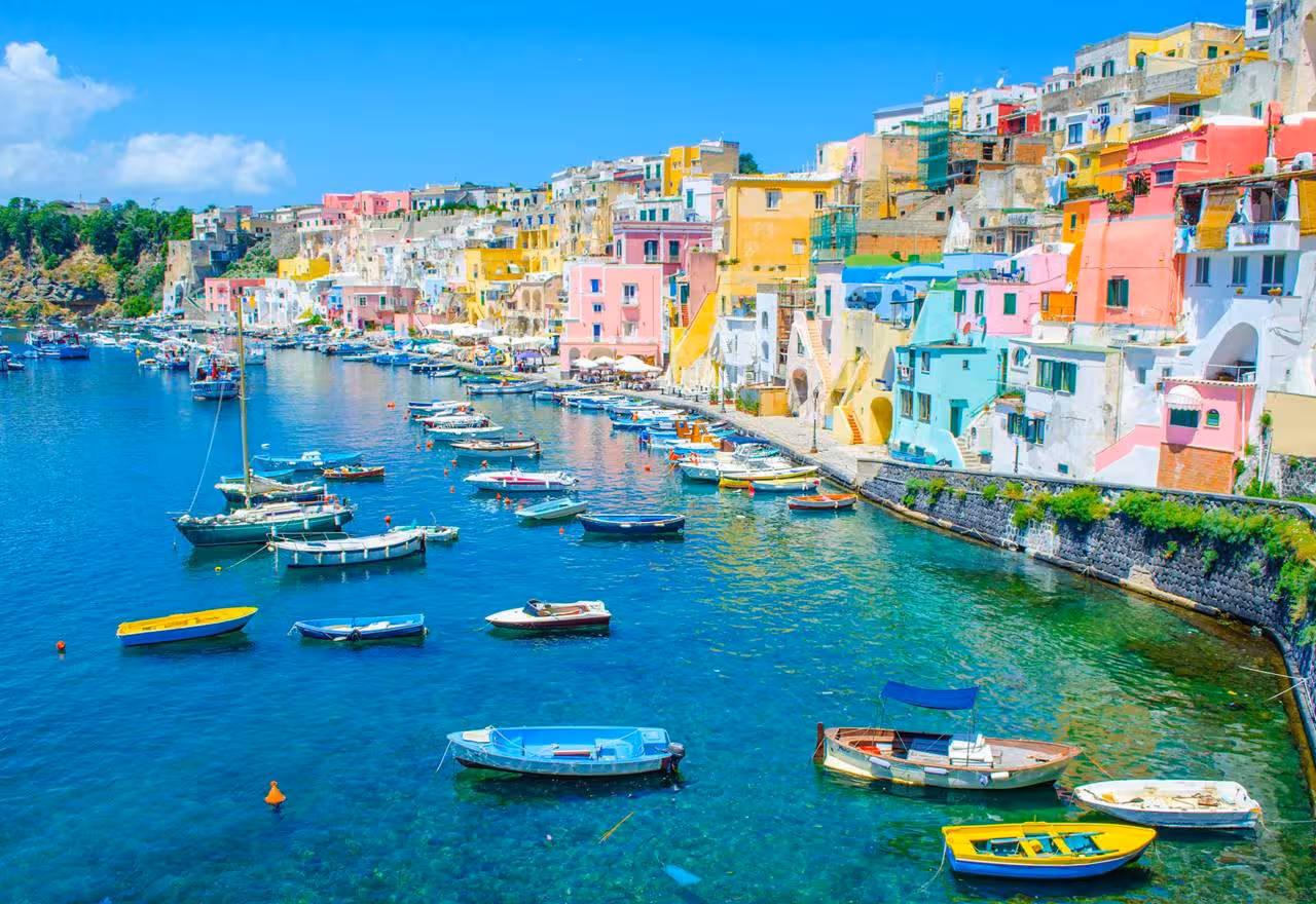 Colorful Marina Corricella on Procida seen from the sea, ideal stop on a boat ride around the island
