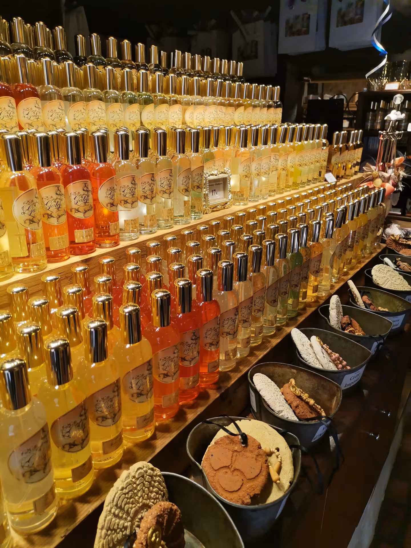 Rows of artisanal Provençal liqueurs and syrups at a local shop stop on a Provençal Picnic Tour
