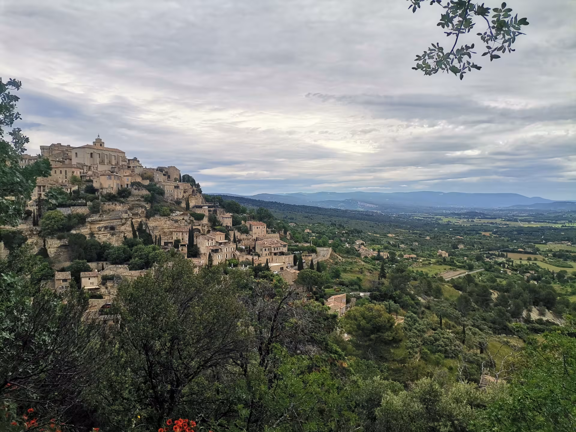 Panoramic view of a hilltop village and Luberon valley in Provence, scenic stop on a Provençal Picnic Tour