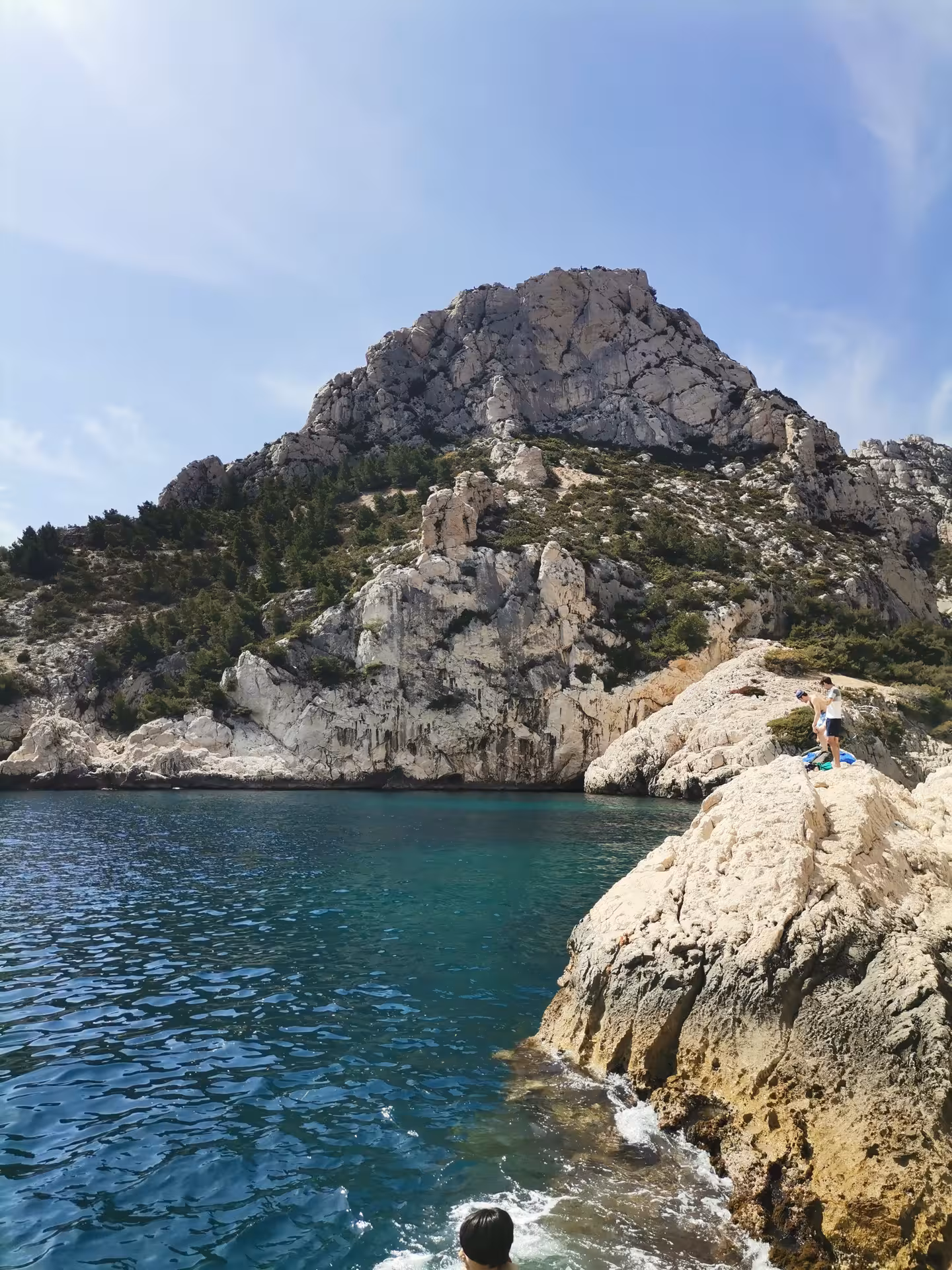 Rocky Calanques cove in Provence with turquoise sea and limestone cliffs on a 7-day guided hiking tour