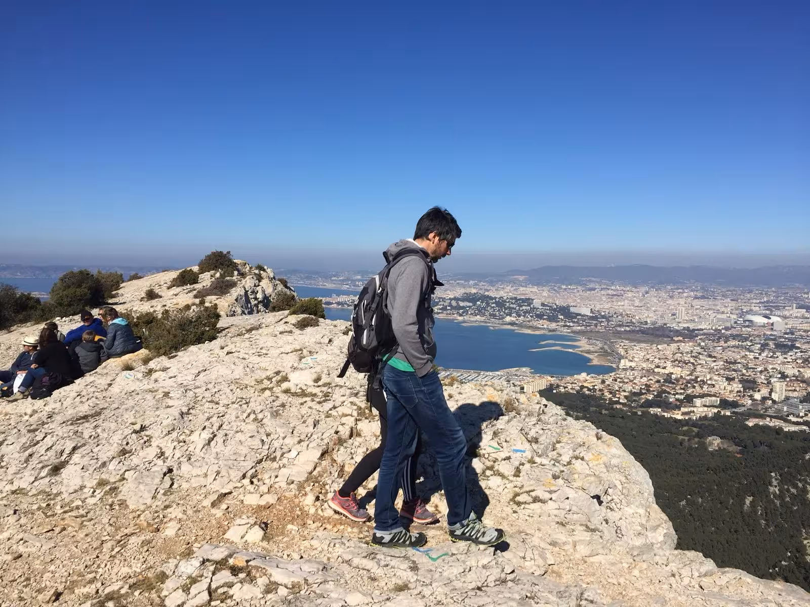 Hikers on a rocky ridge above Marseille on a 7-day Provence hiking tour, gateway to the Calanques