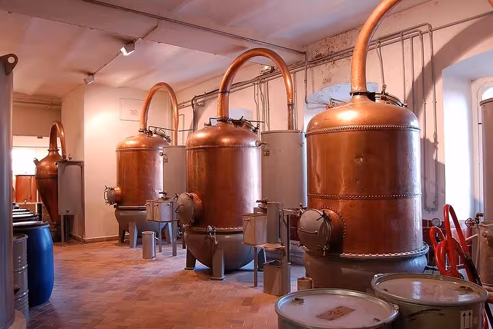 Copper distillation vats inside a Provence perfume factory on a countryside tour.