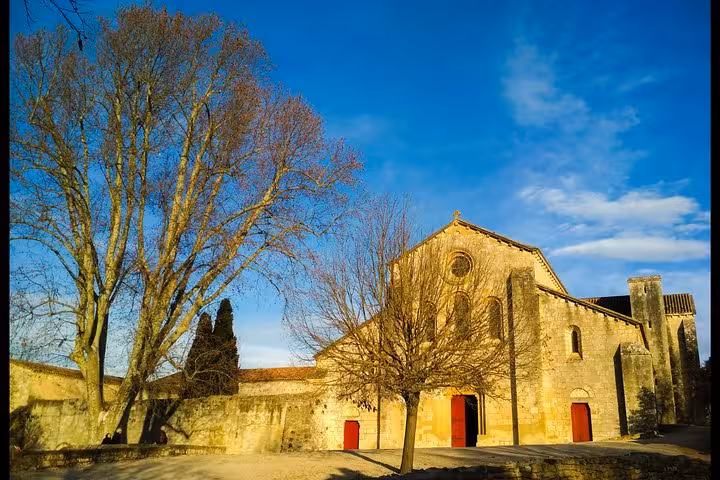 Sunlit Romanesque church in a quiet Provence village, ideal stop on a self-guided, leisurely tour