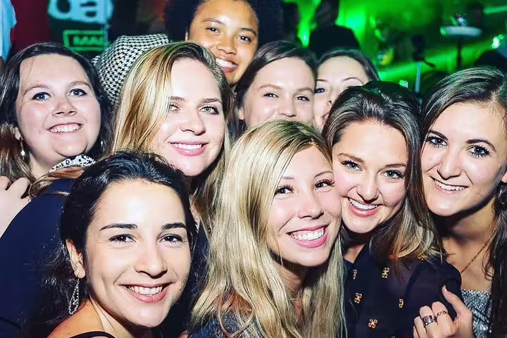 A lively group of friends enjoying a vibrant night out at Pub Crawl Madrid by Mad Party Crew, capturing the essence of Madrid nightlife.