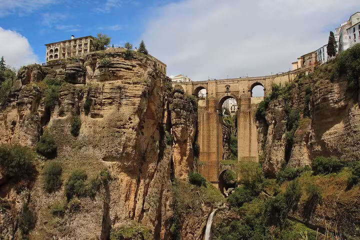 Stunning view of Puente Nuevo bridging the dramatic cliffs of Ronda, a must-see on the Andalucia tour from Costa del Sol.