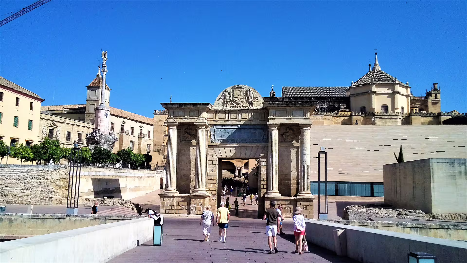 Puerta del Puente and Roman Bridge approach in Córdoba, Spain, featured on a private walking tour route