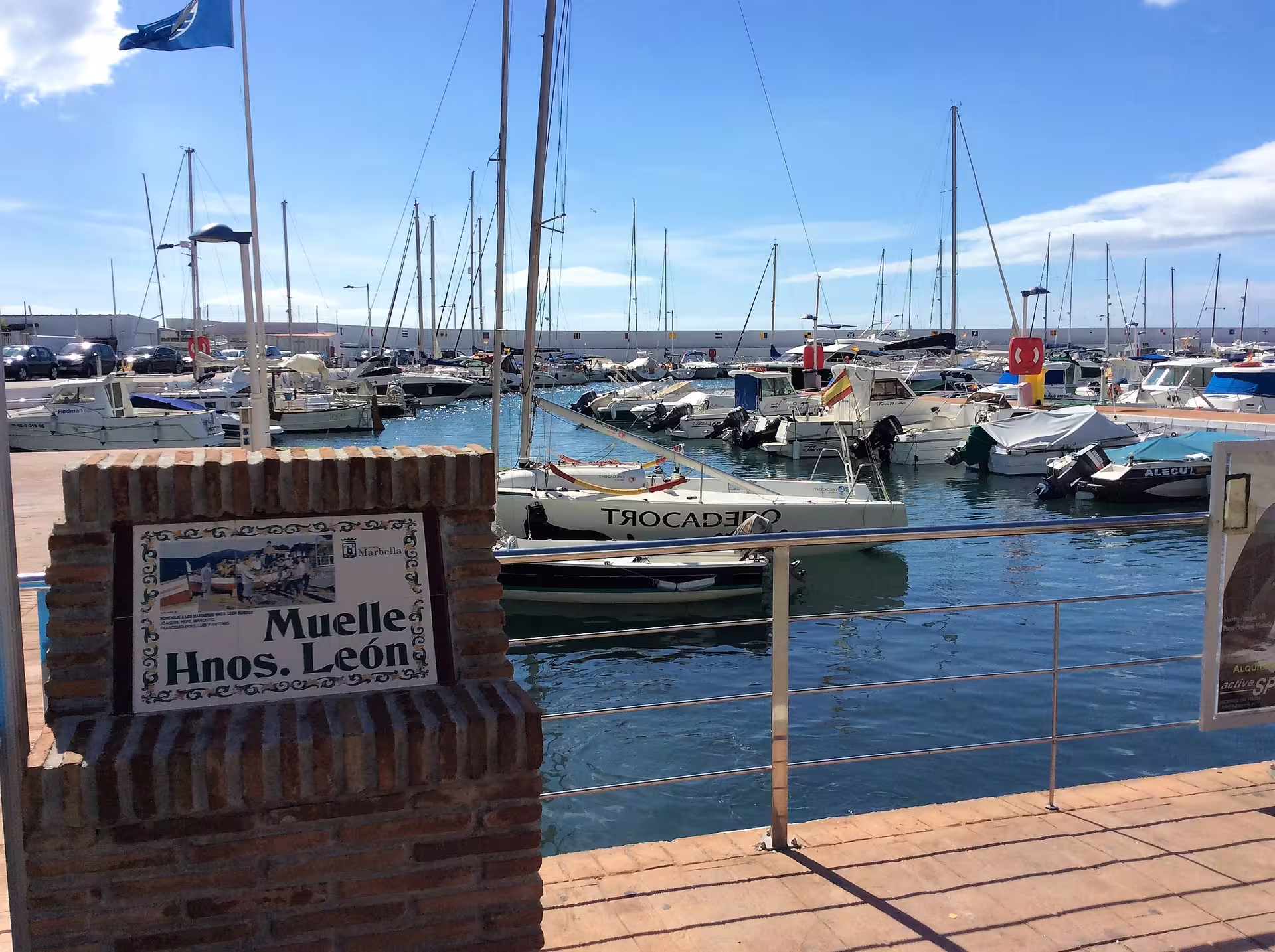 Puerto Banus marina in Marbella with yachts and sailboats, luxury harbor view on private trip with hotel pickup