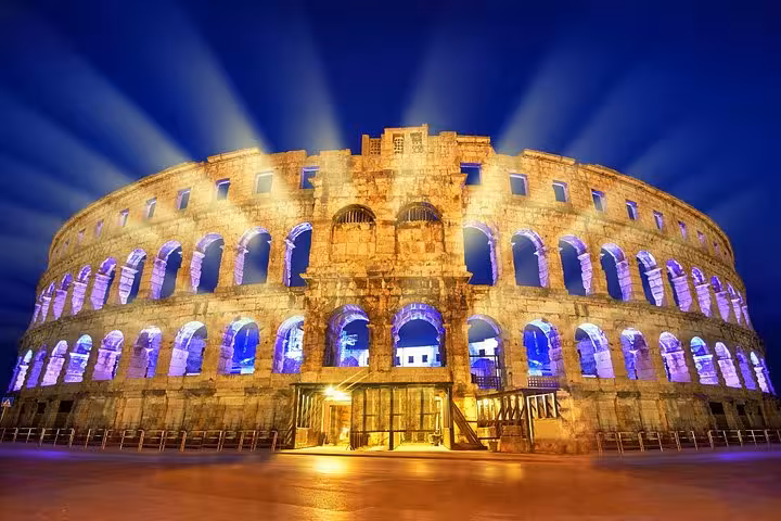 Pula Arena lit up at night, Croatia Roman amphitheater on Highlights from Budapest to Dubrovnik tour