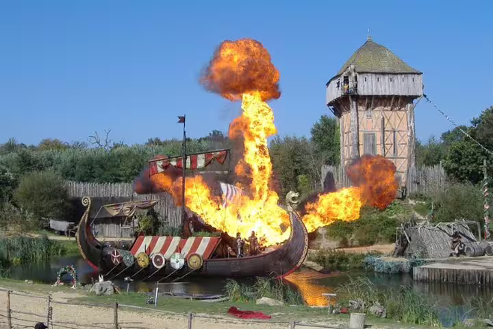 Viking ship battle with fire explosion at Puy du Fou, arrive comfortably with private minivan transportation