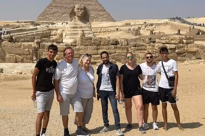 Tour group photo at the Great Sphinx and Pyramids of Giza on a private guided tour with lunch in Cairo