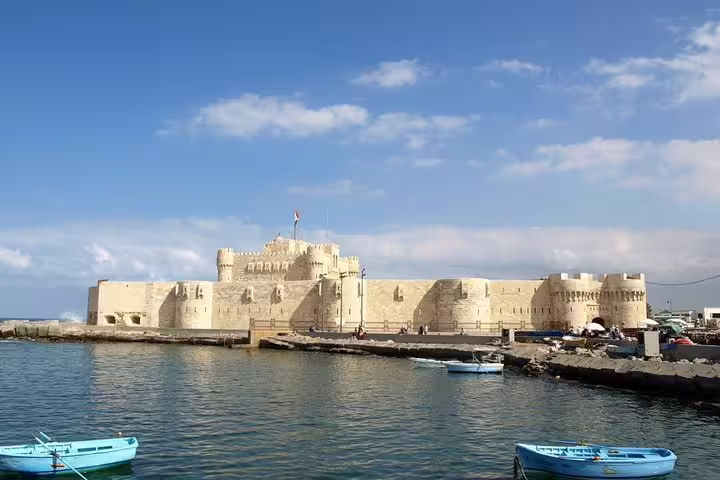 Qaitbay Citadel on Alexandria waterfront with boats, featured on private customized 3-day Egypt tour