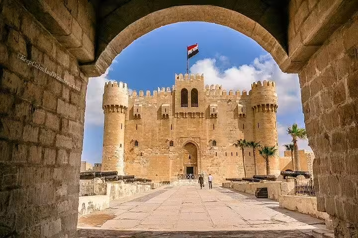 Qaitbay Citadel in Alexandria seen through stone arch, highlight of private shore excursion from port