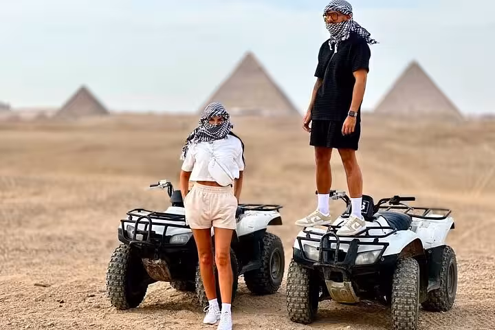 Quad bike adventure near the Giza Pyramids on a private tour, Cairo desert ATV ride with iconic pyramids backdrop
