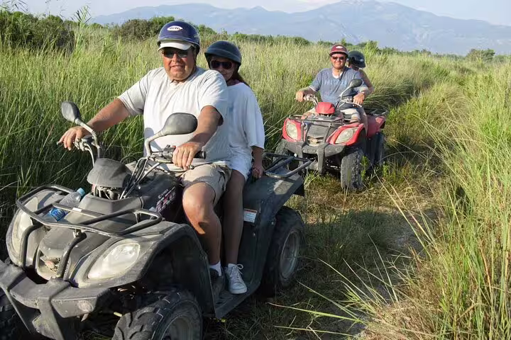 Tourists ride quads along lush trails near Kusadasi Port, offering an adventurous excursion for cruise visitors.