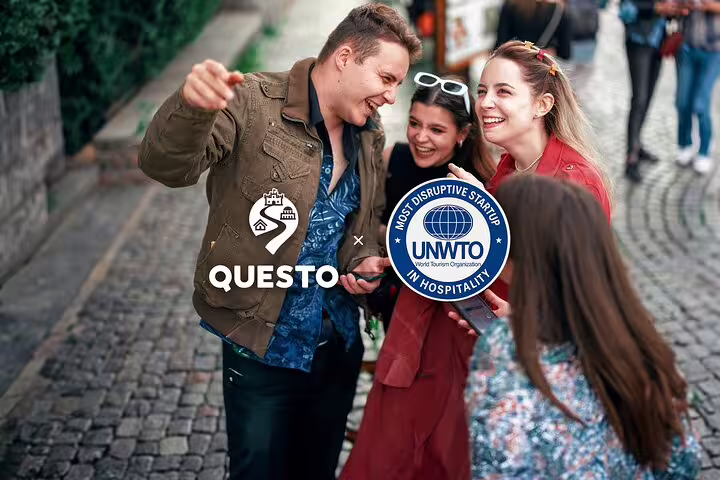 Group of friends laughing on cobblestone street during Frankfurt Old Town walking tour with Questo app