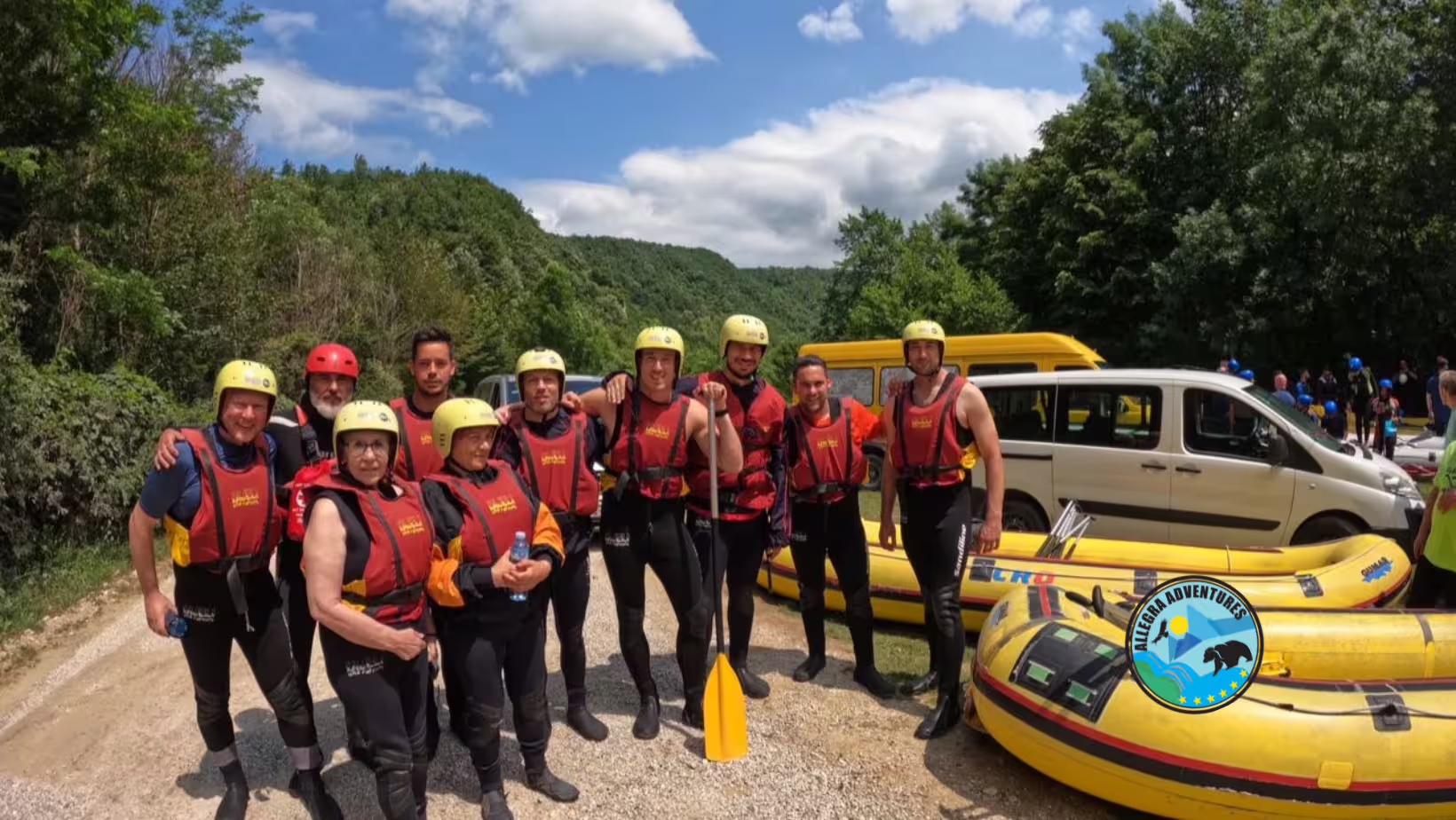 Rafting group geared up near Plitvice Lakes, ready for Una River rafting tour with helmets, vests and rafts