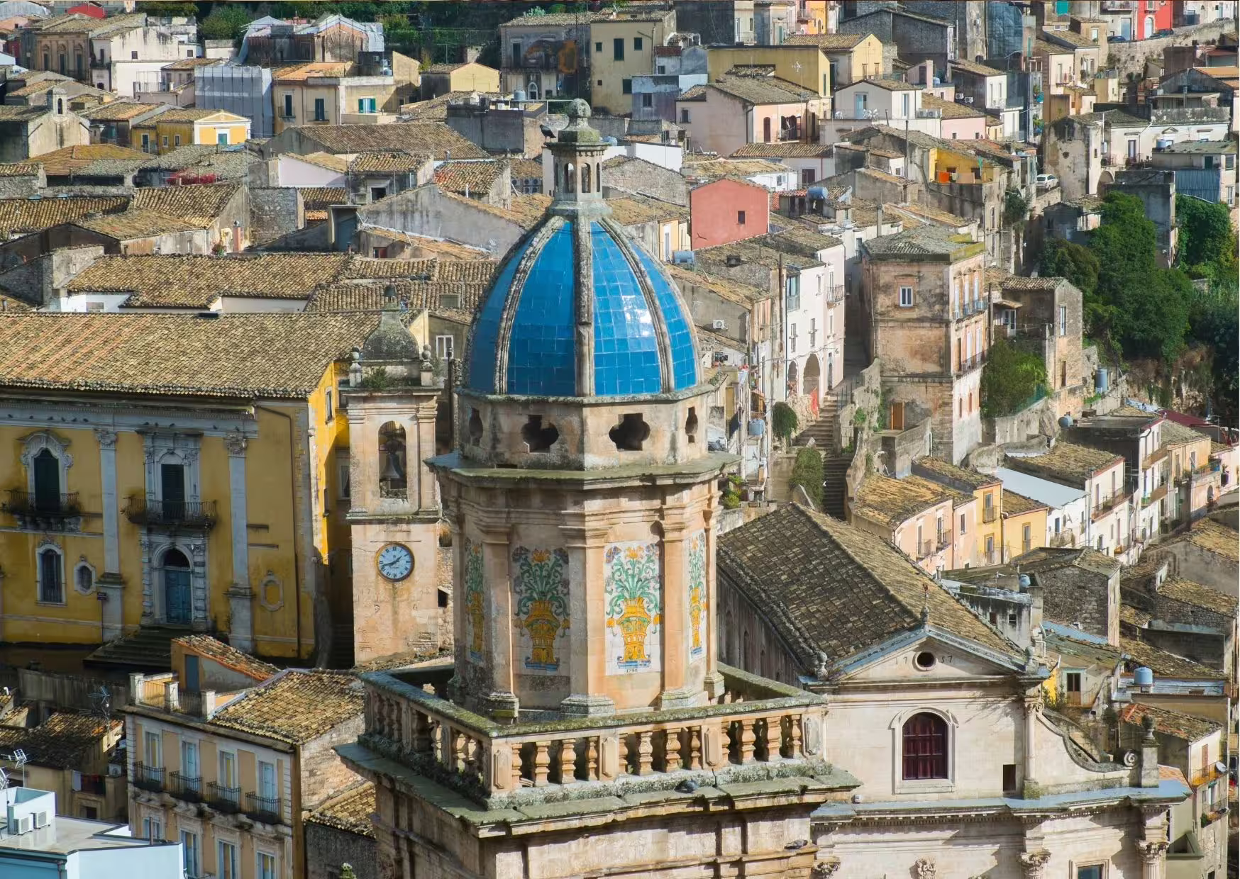 Close-up of Ragusa Ibla baroque church dome and rooftops, key stop on Noto Ragusa Modica day trip from Siracusa