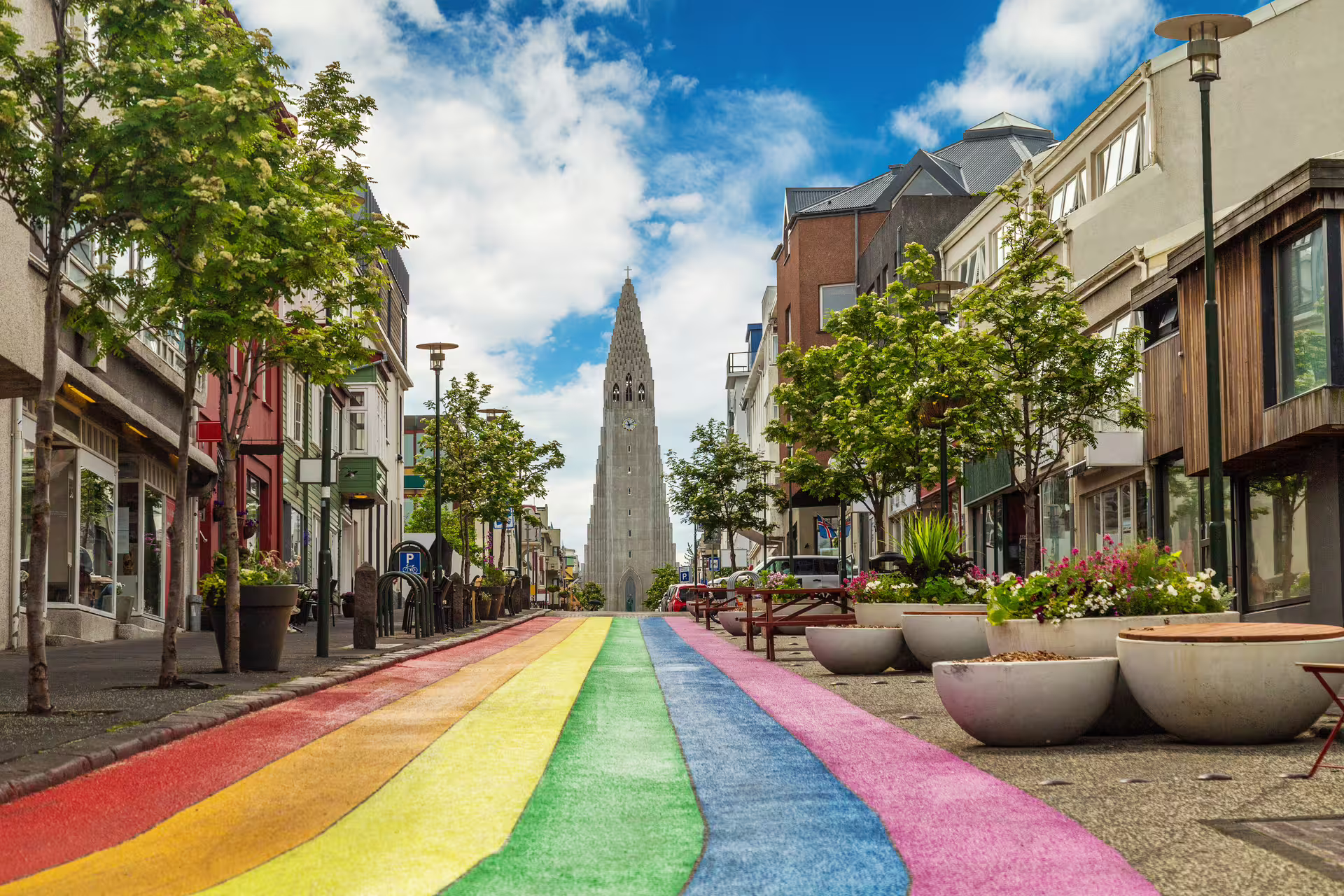 A picture of the Rainbow Street in Reykjavik with the Hallgrimmskirkja at the top