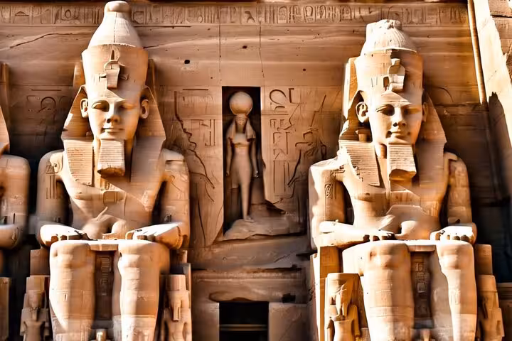 Close-up of Ramses II colossal statues at Abu Simbel on a private full-day temple tour from Aswan