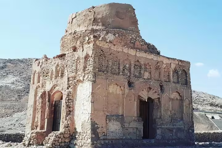 Explore the historic architecture of a rustic stone building in the picturesque landscape of Ras Al Hadd.