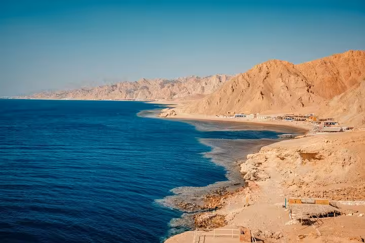 Red Sea coastline near Ras Mohamed on White Island snorkeling cruise from Sharm El Sheikh, desert cliffs