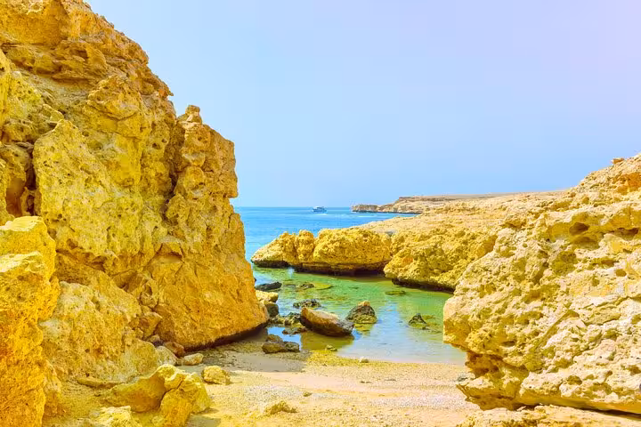 Rocky cove with clear Red Sea water in Ras Mohammed National Park, half-day bus tour from Sharm El Sheikh