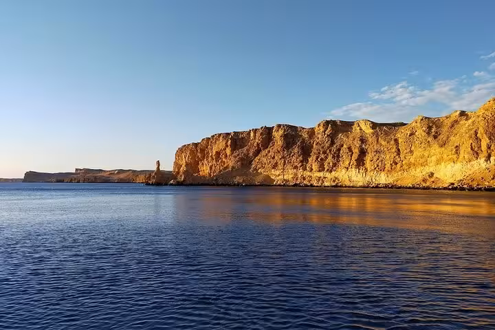 Golden cliffs along Ras Mohammed National Park on VIP White Island cruise from Sharm El Sheikh, Red Sea