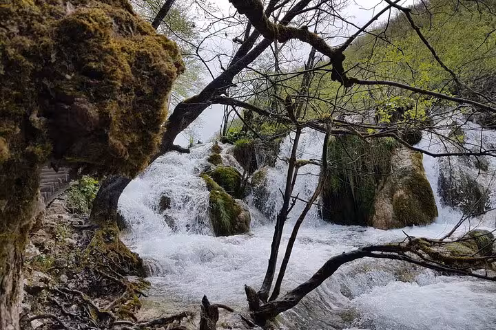 Rastoke village rapids and mossy rocks in Croatia, scenic stop on Zagreb to Plitvice Lakes private tour