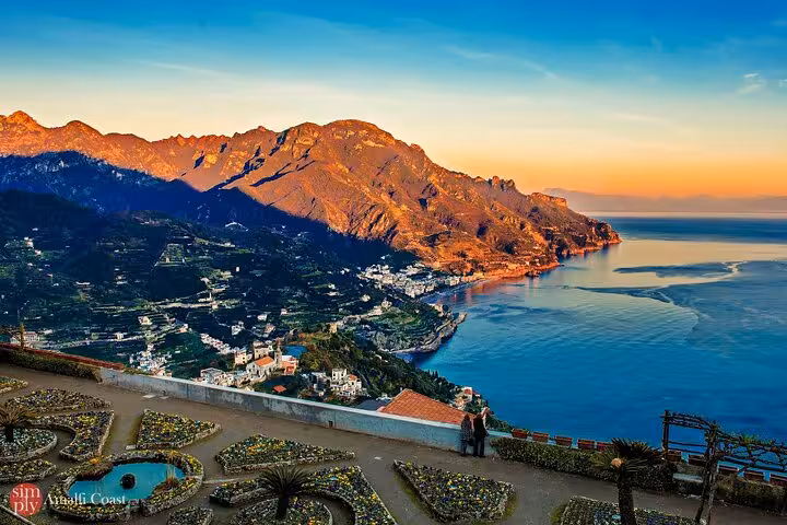Experience breathtaking views of the Amalfi Coast at sunset from Ravello, showcasing majestic mountains and tranquil sea.