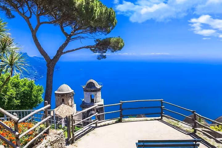 Breathtaking vista from Ravello's terrace with sweeping views of the Amalfi Coast and azure sea, perfect for tours.