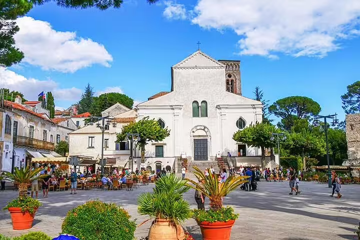 Piazza Duomo in Ravello with Cathedral of Santa Maria Assunta and outdoor cafes on a sunny day