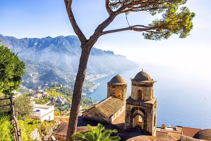 Panoramic view of Ravello's church domes overlooking the Amalfi Coast coastline and mountains