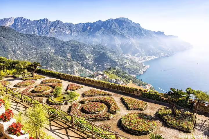 Panoramic view of Ravello's formal gardens overlooking the Amalfi Coast and mountains