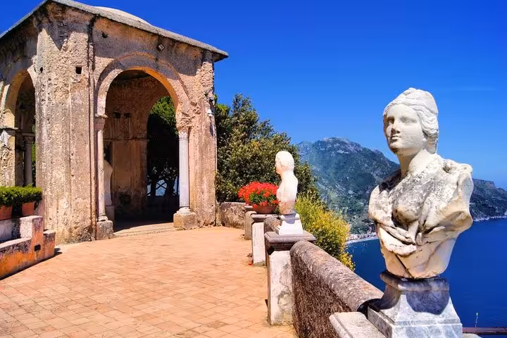 Historic stone pavilion and statues overlooking stunning Amalfi Coast from Ravello, a highlight of the half-day tour.